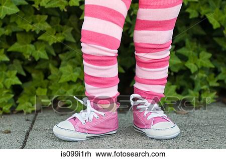 Legs of a toddler in pink striped leggings View Large Photo Image Stock Image - Legs of a toddler in pink striped leggings. Fotosearch