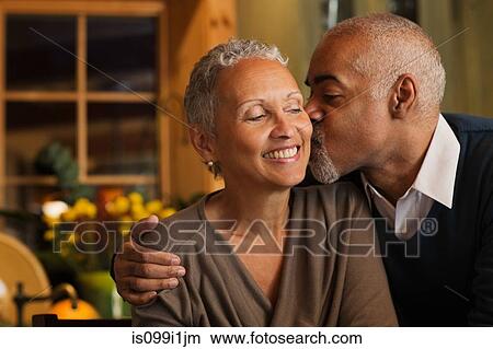 Mature couple kissing View Large Photo Image Picture - Mature couple kissing. Fotosearch