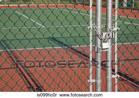 Padlocked chain-link security fence at a tennis court View Large Photo Image Stock Photography - Padlocked chain-link security fence at a tennis court. Fotosearch
