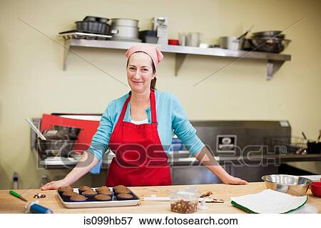 Portrait of woman working in bakery View Large Photo Image Stock Photo - Portrait of woman working in bakery. Fotosearch