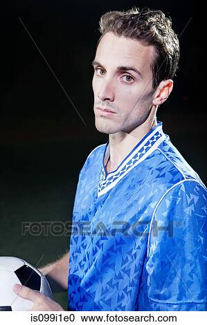 Stock Image - Portrait of young soccer player. Fotosearch
