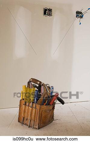 Tool bag on the floor of unfinished room View Large Photo Image Stock Photograph - Tool bag on the floor of unfinished room. Fotosearch