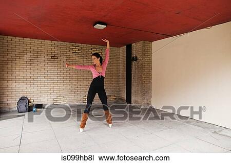Woman performing stretches View Large Photo Image Stock Image - Woman performing stretches. Fotosearch