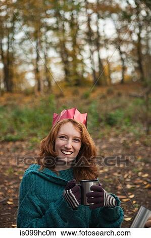 Picture - Young woman wearing crown in forest, portrait. Fotosearch