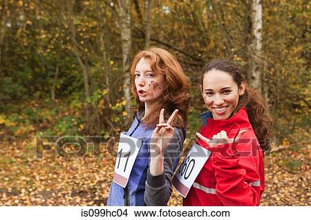 Picture - Young women smiling in forest, portrait. Fotosearch
