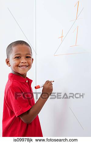 Boy with sum on whiteboard View Large Photo Image Stock Image - Boy with sum on whiteboard. Fotosearch