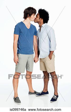 Gay couple kissing against white background View Large Photo Image Stock Image - Gay couple kissing against white background. Fotosearch
