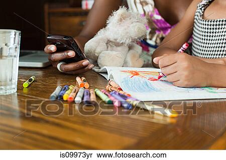 Girl drawing with crayons View Large Photo Image Stock Photography - Girl drawing with crayons. Fotosearch