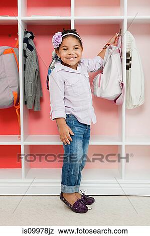 Stock Photo - Girl in school cloakroom. Fotosearch