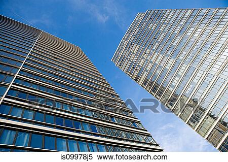 Glass skyscrapers against blue sky View Large Photo Image Stock Photography - Glass skyscrapers against blue sky. Fotosearch