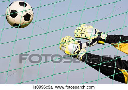 Stock Image - Goalkeeper making a save. Fotosearch