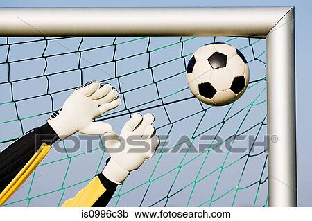 Stock Image - Goalkeeper making a save. Fotosearch