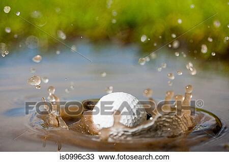 Golf ball splashing into water View Large Photo Image Stock Image - Golf ball splashing into water. Fotosearch