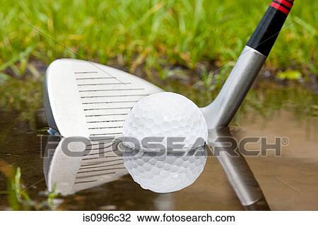 Golf club hitting golf ball out of water View Large Photo Image Stock Image - Golf club hitting golf ball out of water. Fotosearch