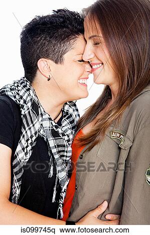 Lesbian couple smiling against white background View Large Photo Image Stock Photography - Lesbian couple smiling against white background. Fotosearch