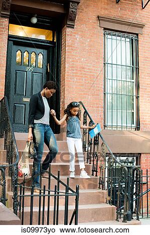Mother and daughter leaving house View Large Photo Image Picture - Mother and daughter leaving house. Fotosearch