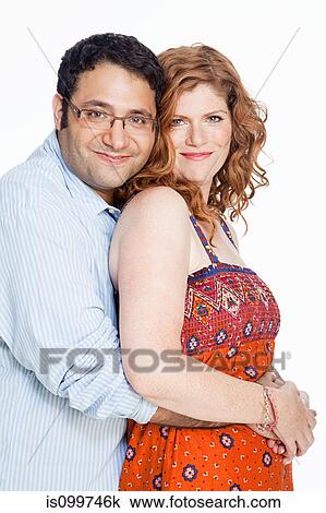 Portrait of couple against white background View Large Photo Image Stock Image - Portrait of couple against white background. Fotosearch