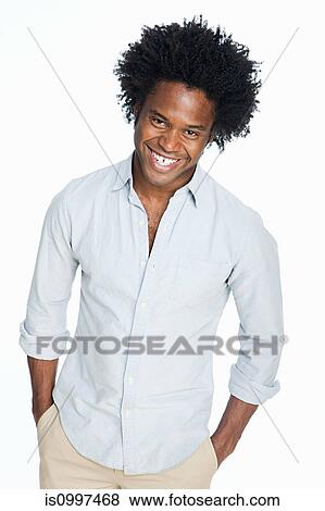 Portrait of young man against white background View Large Photo Image Stock Photo - Portrait of young man against white background. Fotosearch