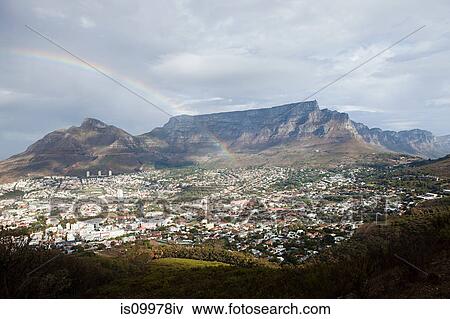 Stock Photo - View across Cape Town to Table Mountain and Twelve Apostles mountain chain from Signal Hill, South Africa. Fotosearch