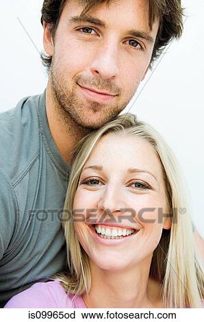 Young couple smiling on staircase View Large Photo Image Stock Image - Young couple smiling on staircase. Fotosearch
