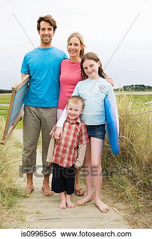 Young family on beach, portrait View Large Photo Image Stock Photography - Young family on beach, portrait. Fotosearch
