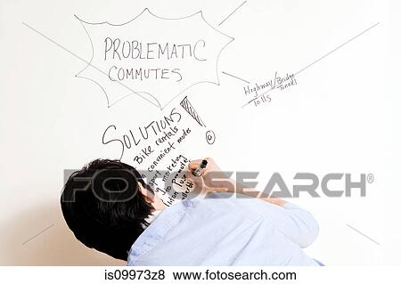 Young man writing on whiteboard View Large Photo Image Stock Photo - Young man writing on whiteboard. Fotosearch