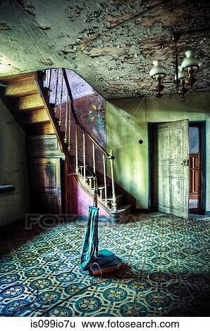 Stock Photograph - Abandoned hallway with old vacuum cleaner. Fotosearch