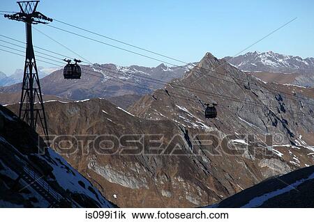 Cable cars over mountains View Large Photo Image Stock Image - Cable cars over mountains. Fotosearch