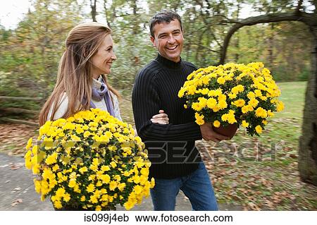 Couple with plants View Large Photo Image Stock Image - Couple with plants. Fotosearch
