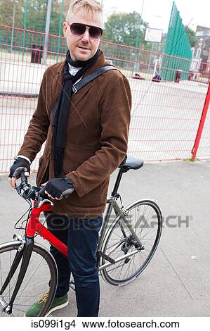 Cyclist in urban setting View Large Photo Image Picture - Cyclist in urban setting. Fotosearch