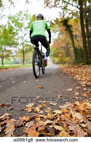 Cyclist on path View Large Photo Image Stock Photo - Cyclist on path. Fotosearch