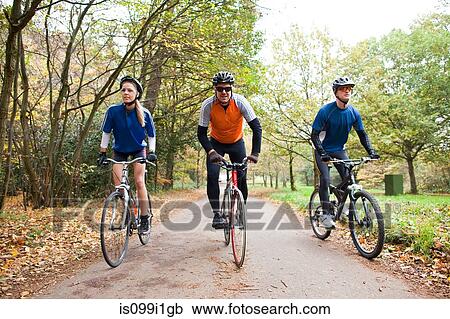 Cyclists on path in park View Large Photo Image Stock Image - Cyclists on path in park. Fotosearch