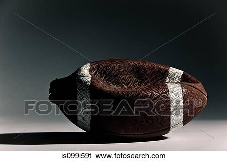 Stock Photograph - Deflated american football. Fotosearch
