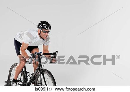Stock Photo - Determined male cyclist. Fotosearch