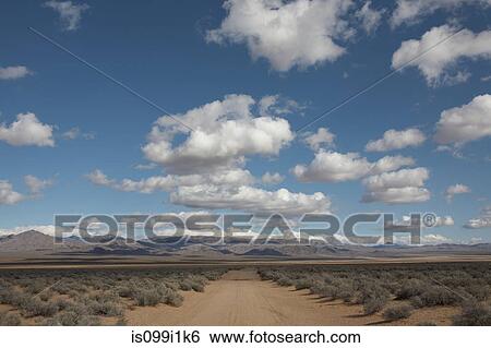 Empty dirt road in desert View Large Photo Image Stock Photograph - Empty dirt road in desert. Fotosearch