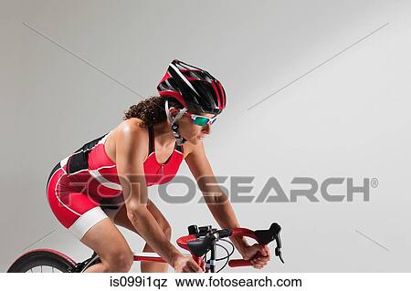 Stock Photo - Female cyclist. Fotosearch