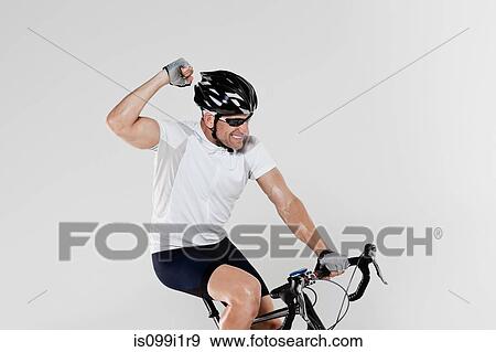 Male cyclist cheering View Large Photo Image Stock Photo - Male cyclist cheering. Fotosearch