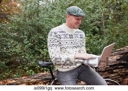 Man outdoors with laptop and bike View Large Photo Image Stock Photography - Man outdoors with laptop and bike. Fotosearch
