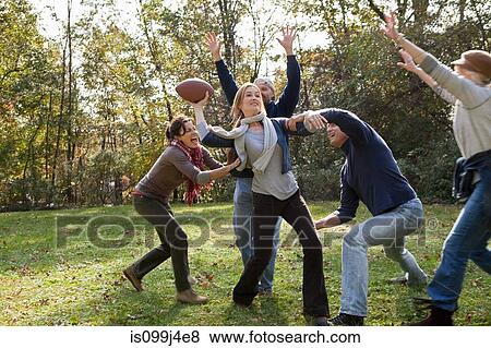 Mature friends playing football View Large Photo Image Stock Photo - Mature friends playing football. Fotosearch