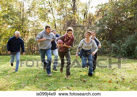 Mature friends playing football View Large Photo Image Stock Photo - Mature friends playing football. Fotosearch