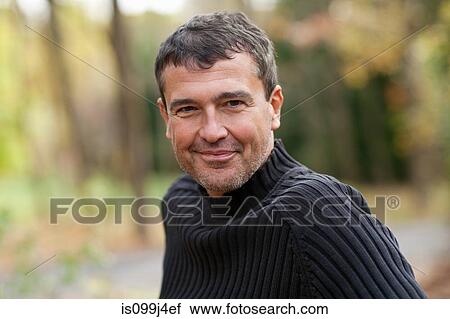 Stock Image - Mature man outdoors. Fotosearch