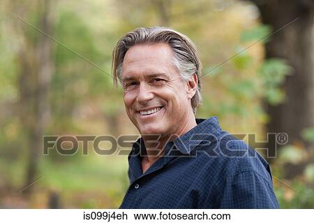 Stock Image - Mature man outdoors. Fotosearch