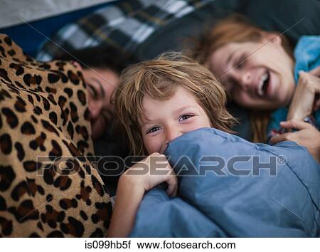 Stock Image - Mother and children in a tent. Fotosearch