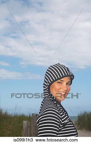 Portrait of mid adult woman in striped hooded top View Large Photo Image Stock Image - Portrait of mid adult woman in striped hooded top. Fotosearch