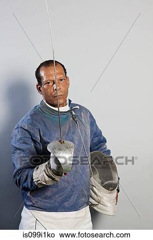 Portrait of senior man in fencing suit View Large Photo Image Picture - Portrait of senior man in fencing suit. Fotosearch