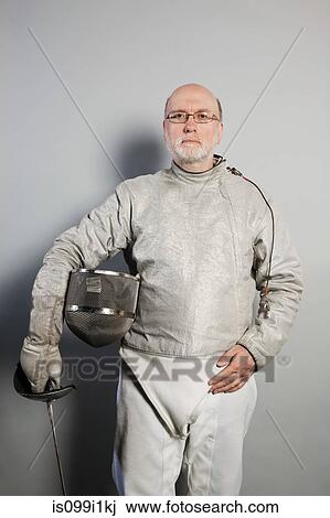 Portrait of senior man in fencing suit View Large Photo Image Stock Image - Portrait of senior man in fencing suit. Fotosearch