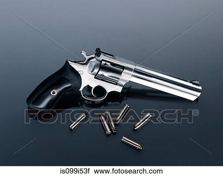 Stock Image - Revolver and bullets. Fotosearch