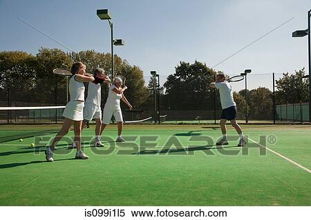 Senior and mature adults practising tennis View Large Photo Image Stock Photography - Senior and mature adults practising tennis. Fotosearch
