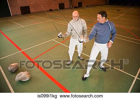 Senior and mature men fencing together View Large Photo Image Stock Image - Senior and mature men fencing together. Fotosearch