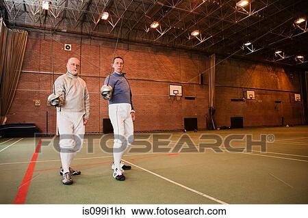 Senior and mature men fencing together View Large Photo Image Stock Image - Senior and mature men fencing together. Fotosearch